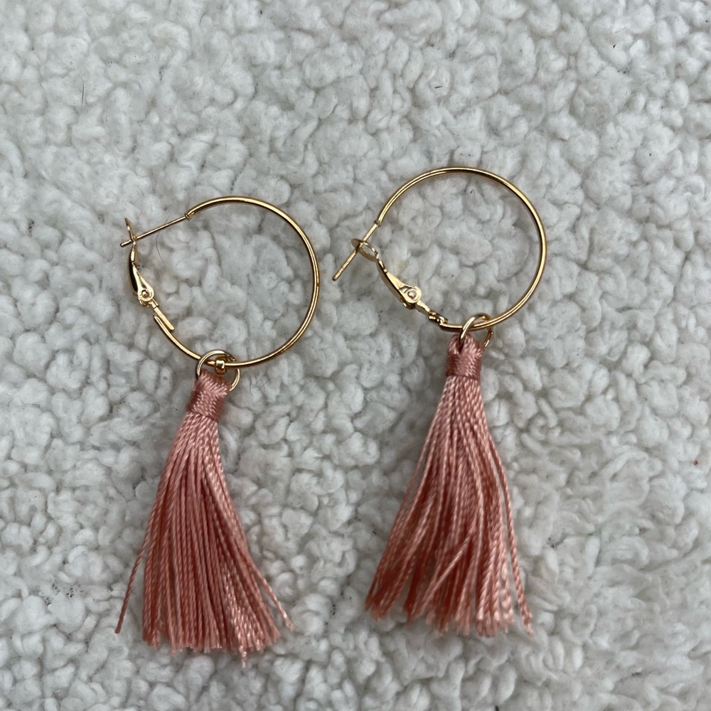 Gold hoops with pink tassel